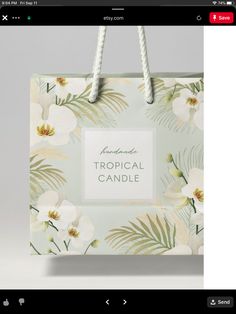 a shopping bag with tropical flowers on it