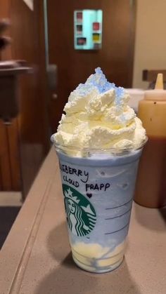 a starbucks drink with whipped cream on top