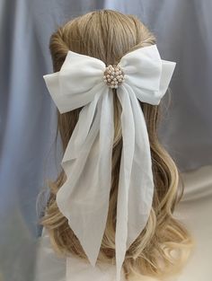 Add a touch of elegance and glamour to your special day with this stunning WHITE Chiffon Hair Bow. Adorned with a sparkling Rhinestone & Faux Pearl Centerpiece, this exquisite accessory is perfect for the Bride To Be, whether for the wedding day, hen party, or bachelorette celebration. This Booty Brooch Clip features a long tail bow design that will surely make you stand out as the belle of the ball. Make a statement with this beautiful bow on your big day! The bow is fitted with a sturdy French Elegant White Veil For Ceremony, Elegant White Ceremony Veil, Elegant Wedding Hair Accessories With Ribbon, Elegant White Veil For Party, Elegant White Party Veil, Elegant White Bridal Accessories For Wedding, Elegant White Formal Veil, Adjustable Wedding Hair Accessories With Decorative Bow, Elegant White Hair Accessories With Decorative Bow