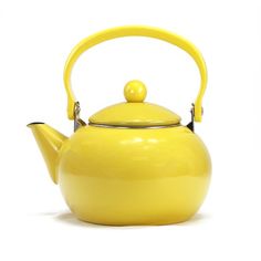 a yellow tea pot with a handle on it's side and a white background