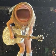 a woman in white and gold outfit holding a guitar