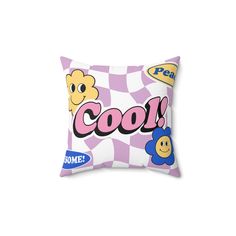 a pillow with the word cool on it and two smiley faces in front of a checkered background