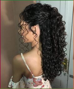 the back of a woman's head with curly hair