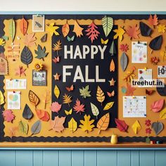 a bulletin board decorated with autumn leaves and the words happy fall written on it in black