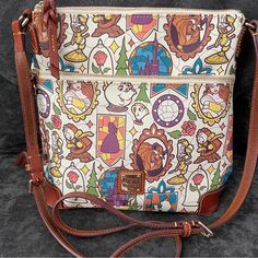 Disney Dooney And Bourke Beauty And The Beast Print. Large Crossbody Bag. Adjustable Strap. Large Zip Front Pocket. Canvas Purple Interior. Large Deep Interior Zip Pocket. 3 Slip Pockets. Perfect Condition. Open To Offers. Please No Low Ball. This Is A Rare And Discontinued Print No Longer Made. Large Crossbody Bag, Beauty And Beast, Disney Adult, Disney Dooney, Purple Interior, Large Crossbody Bags, Dooney And Bourke, Dooney & Bourke Bags, Dooney & Bourke