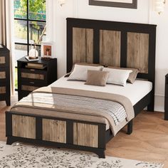 a bedroom with a bed, night stand and two nightstands in black finish wood