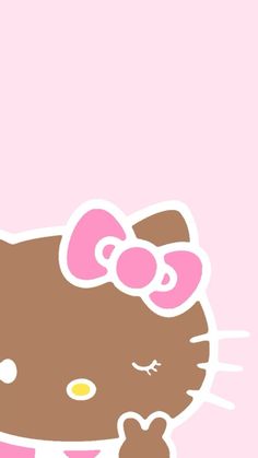 the hello kitty wallpaper is pink and has a bow on it's head