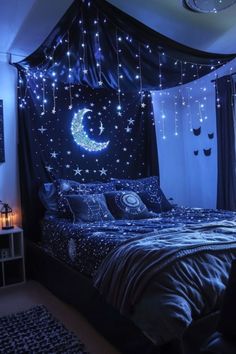 a bed room with a neatly made bed covered in stars and moon decorations on the wall