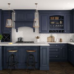 a kitchen with dark blue cabinets and white counter tops, two stools in front of the sink