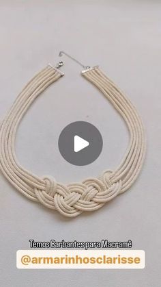 the video shows how to make a braided necklace