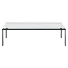 a glass table with metal legs on a white background