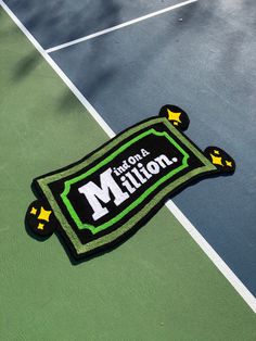 there is a patch on the tennis court that says i am not a million