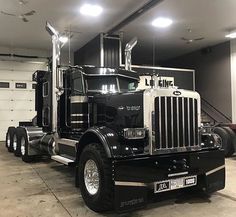 a large semi truck parked in a garage