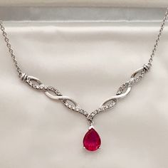 Sterling Silver Diamond Swirl Ruby Necklace Stunning! ( 16" Chain With Lobster Closure, Marked .925) This Is Truly A Beautiful And Fun Piece. The Accent Diamonds Give That Perfect Frame Of Sparkle To The Two Carat Pear Shaped Ruby. Genuine Diamond Accents With Lab Created Ruby. This Item Is Wonderful Estate Condition. See All Our Photos For Complete Details. Comes In Original Packaging, Silk & Velvet Snap Envelope. Red Ruby Necklace, Uk Trip, Kay Jewelers, Ruby Necklace, Silk Velvet, Silver Diamonds, Pear Shaped, Silver Necklaces, Womens Jewelry Necklace