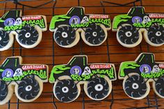 four decorated cookies with monster trucks on them