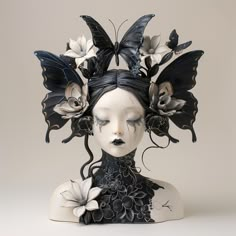 a woman's head with black and white butterflies on it