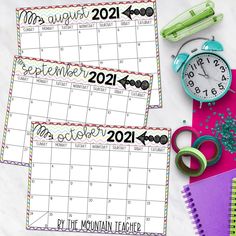 two calendars with the words november to december on them and some scissors, pencils, paper clips, and other office supplies