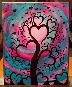 a painting of a tree with hearts painted on it