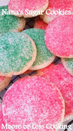 pink, green and white sugar cookies on a cooling rack with the words more or less cooking