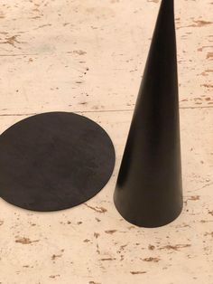 two black cones sitting next to each other