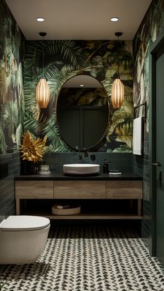 a bathroom with black and white tiled flooring and green wallpaper on the walls