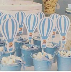 blue and white hot air balloons in buckets with marshmallows on them