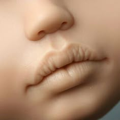 a close up view of a doll's nose