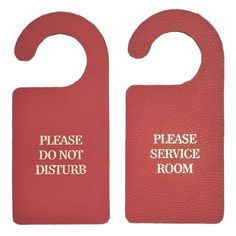 two red door hangers that say please don't disturb and do not disturb