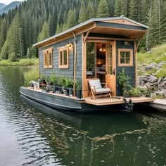 a small house boat is floating on the water