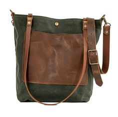 a brown and green bag with straps on it's sides, sitting against a white background