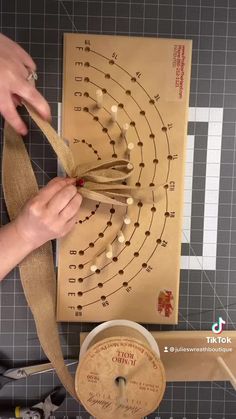 a person is making a wooden instrument