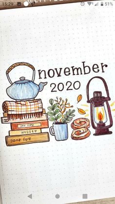 an open notebook with the words november written on it and illustrations of teapots, books