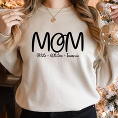 Personalized Mom Sweatshirt, Mom Hoodie, Mommy Sweatshirt, Gift for Mom Day, Mother's Day Sweatshirt, Gift for Mama, Mommy Hoodie ----------------------------------------- 👕 Welcome to byTDG! 👕 💖 TDG wishes you a pleasant shopping experience. 👕  We are here to offer you the most suitable shirt options. We want to make everyone smile with our cute, stylish and trendy graphic t-shirts. We can assume that this shirt will be the perfect gift for yourself or someone else.   Be sure to examine the Etsy Shirts, For Mom, Trendy Tees, Mother Family, Best Valentine's Day Gifts, Mom Hoodies, Cute Graphic Tees, Mom Day, Tee Shirt Designs