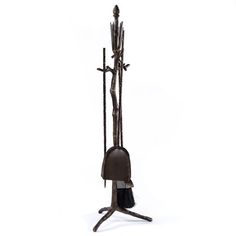 a metal stand with a broom and some other items on it's legs, against a white background