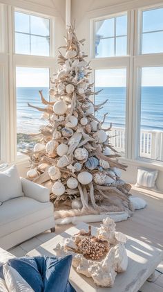 a living room with a christmas tree in the center and seashells on the table