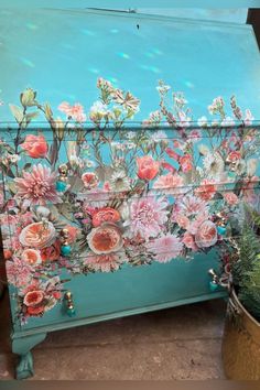 an ornate painted chest with flowers on it