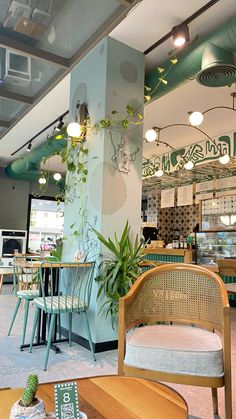 the inside of a restaurant with tables and chairs