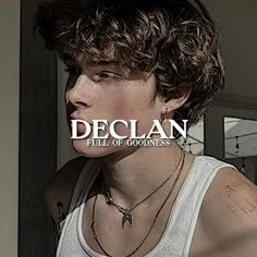 a young man wearing a white tank top with the word declan written on it