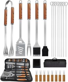 an assortment of cooking utensils including spatulas, forks and tongs