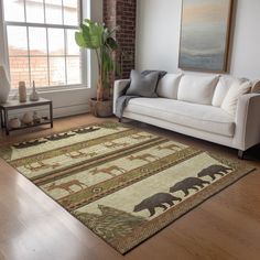 a living room with a white couch and brown bear rug on the floor next to a window