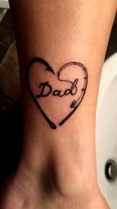 a heart with the word dad written on it and an arrow in the shape of a heart