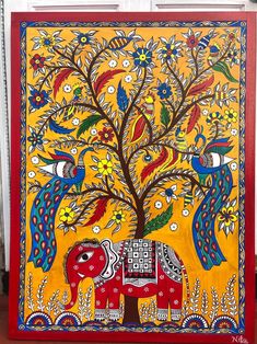 an elephant painted on the side of a wall next to a tree with birds and flowers