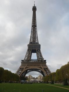 the eiffel tower is very tall and has a clock on it's side