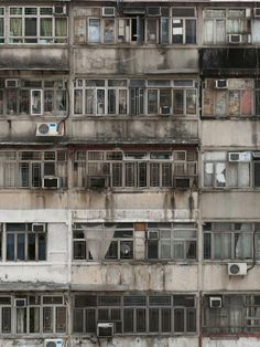 an old building with lots of windows and balconies