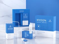 the hyeon happy drink packaging is displayed on a countertop next to other items