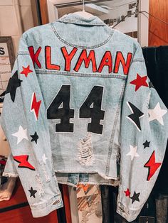 Painted Denim Jacket Football, Jean Jacket Painted Football, Painted Football Jean Jacket, Nfl Denim Jacket, Senior Jean Jacket Painted, Football Denim Jacket, Diy Custom Jean Jacket, Painted Jean Jacket School Spirit, Football Jean Jacket