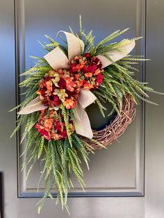 a wreath is hanging on the front door