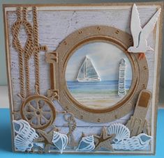 a card with an image of a sailboat, seagulls and seashells