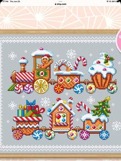 a cross stitch pattern with a train and christmas decorations