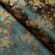 an image of a floral print fabric with many colors and patterns on the surface,